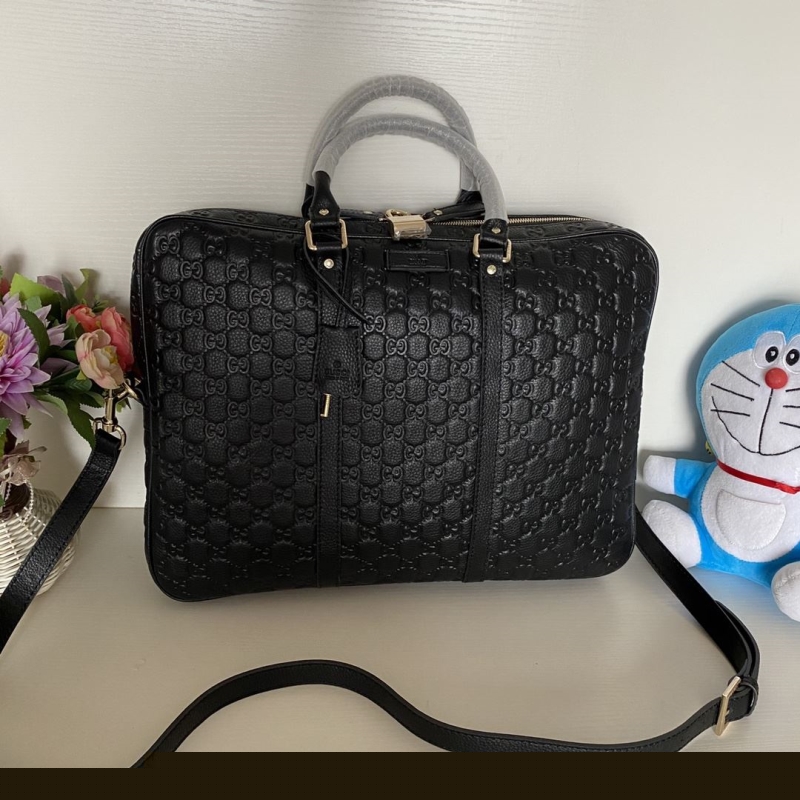 G*u*i top handle bags